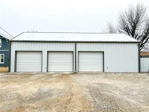 Professional steel building construction team at work on industrial project